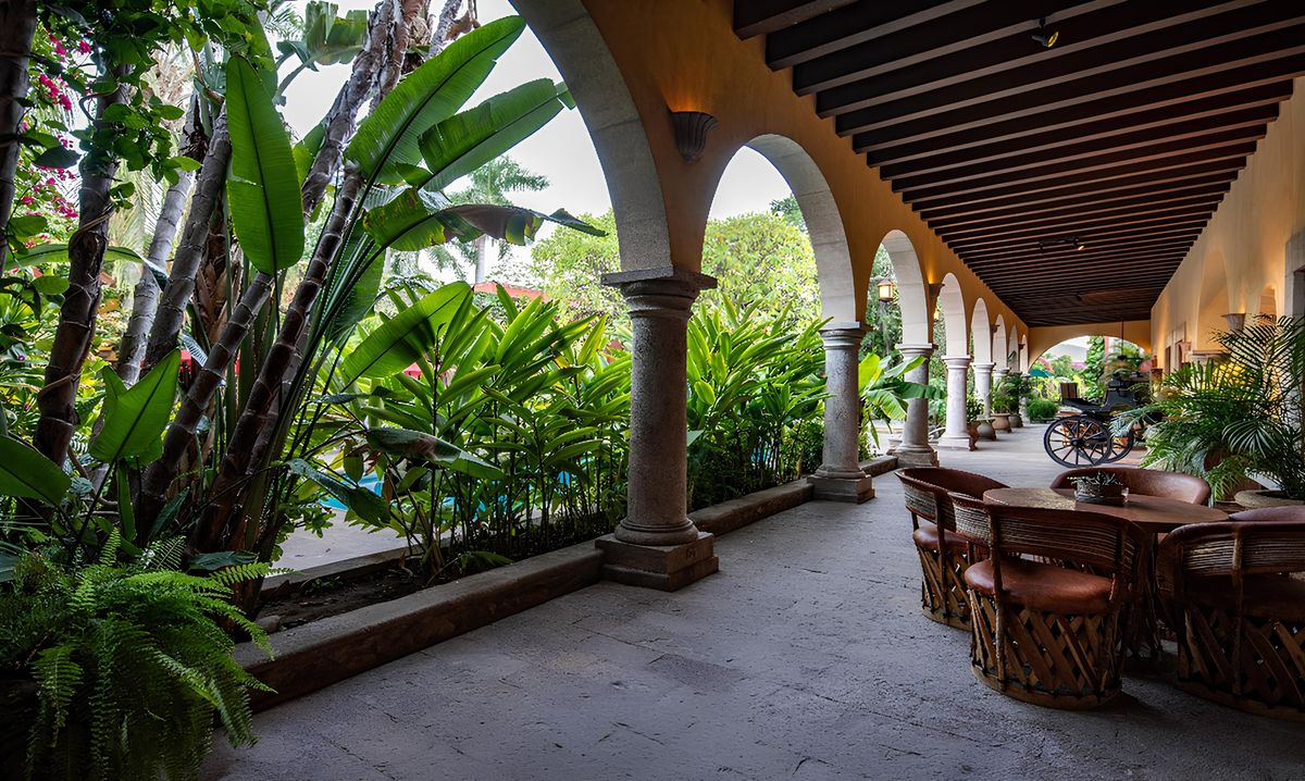 The hacienda colonnade walkway and gardens